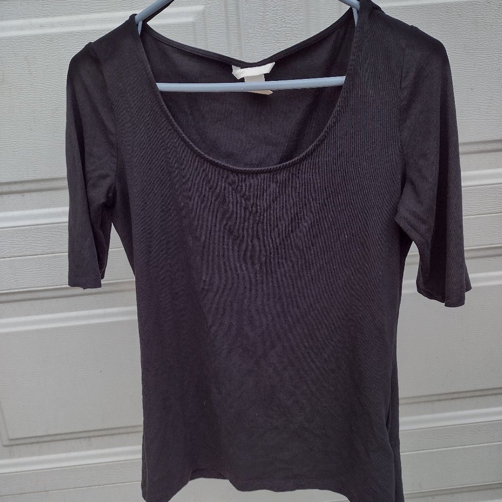 An "H&M" brand black shirt